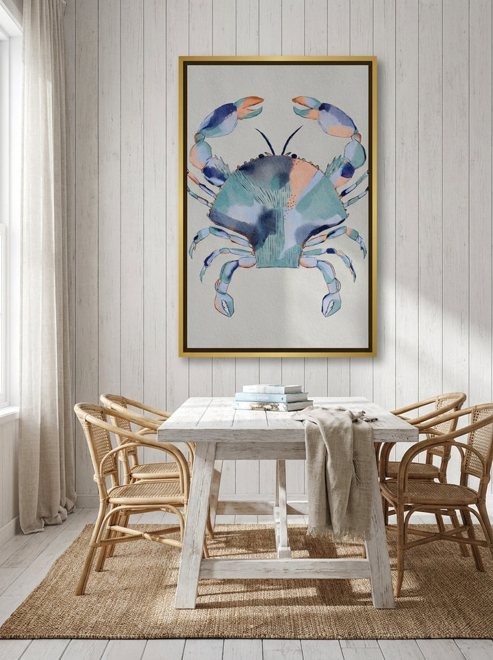 Oversized statement canvas wall art with a gold leaf surround styled on the wall in a coastal dining room