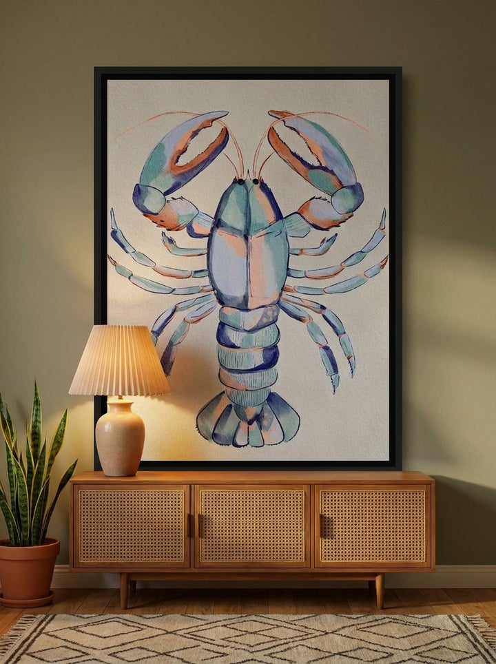 Canvas wall art with a black surround styled on the wall in a mid-century living room