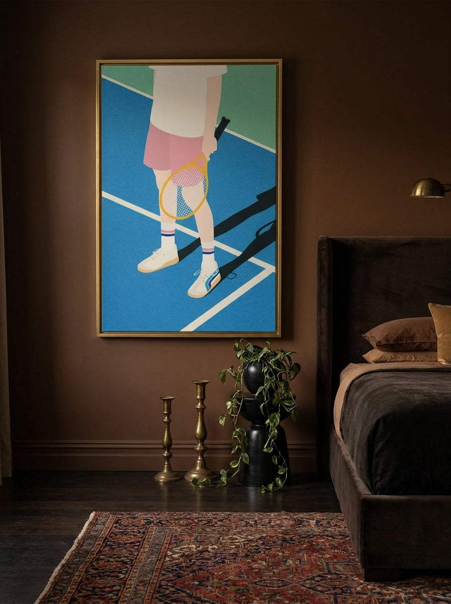 Canvas wall art with a gold leaf surround styled on the wall in a moody bedroom