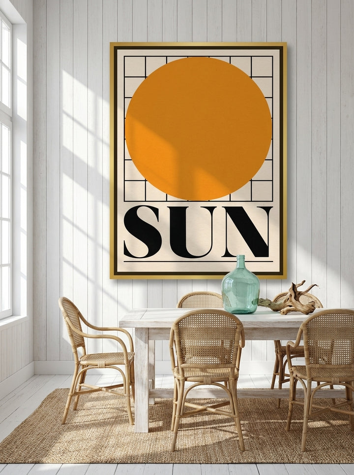 Oversized statement canvas wall art with a gold leaf surround styled on the wall in a coastal dining room