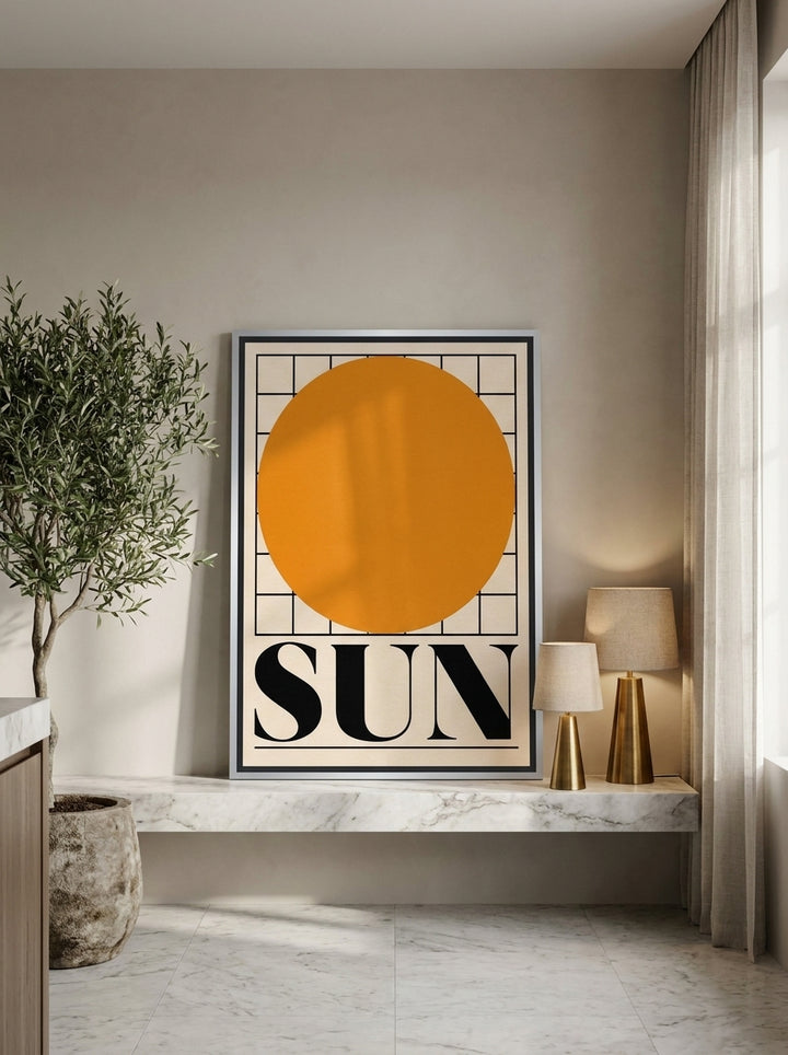 Canvas wall art with a silver leaf surround standing on a kitchen bench in a luxe kitchen