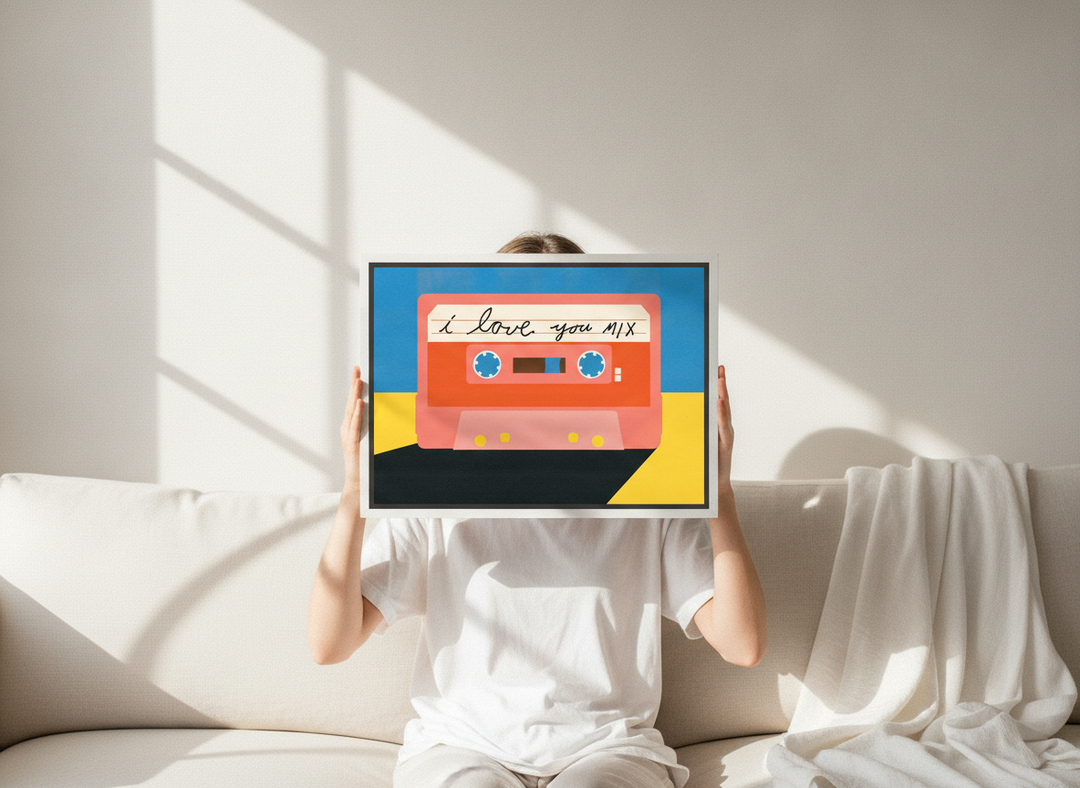 Person holding canvas wall art with a white surround in a coastal living room