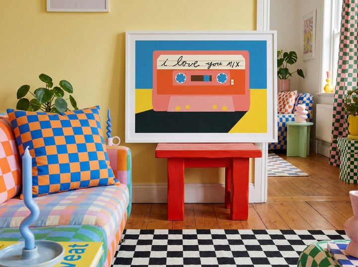 Modern wall art print standing on a side table in a colourful eclectic living room