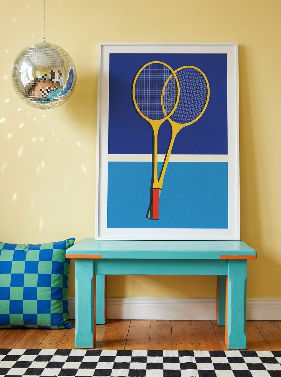 Modern wall art print standing on a side table in a colourful eclectic living room