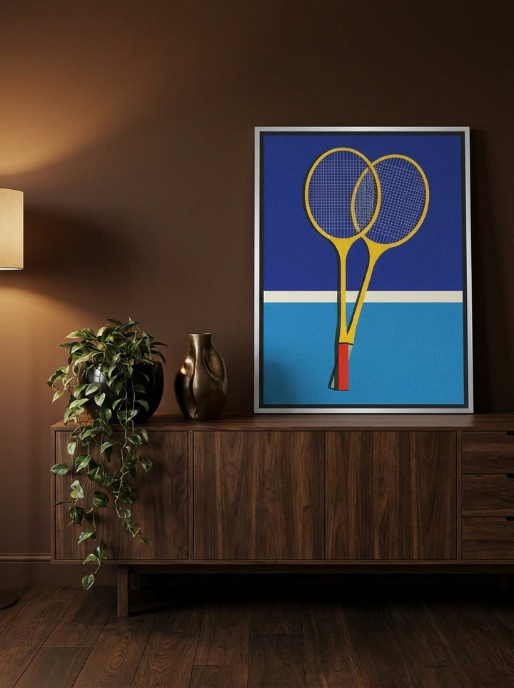Canvas wall art with a silver leaf surround standing on a sideboard in a moody bedroom