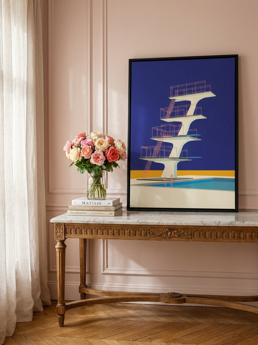 Canvas wall art with a black surround standing on a console in a Parisian bedroom