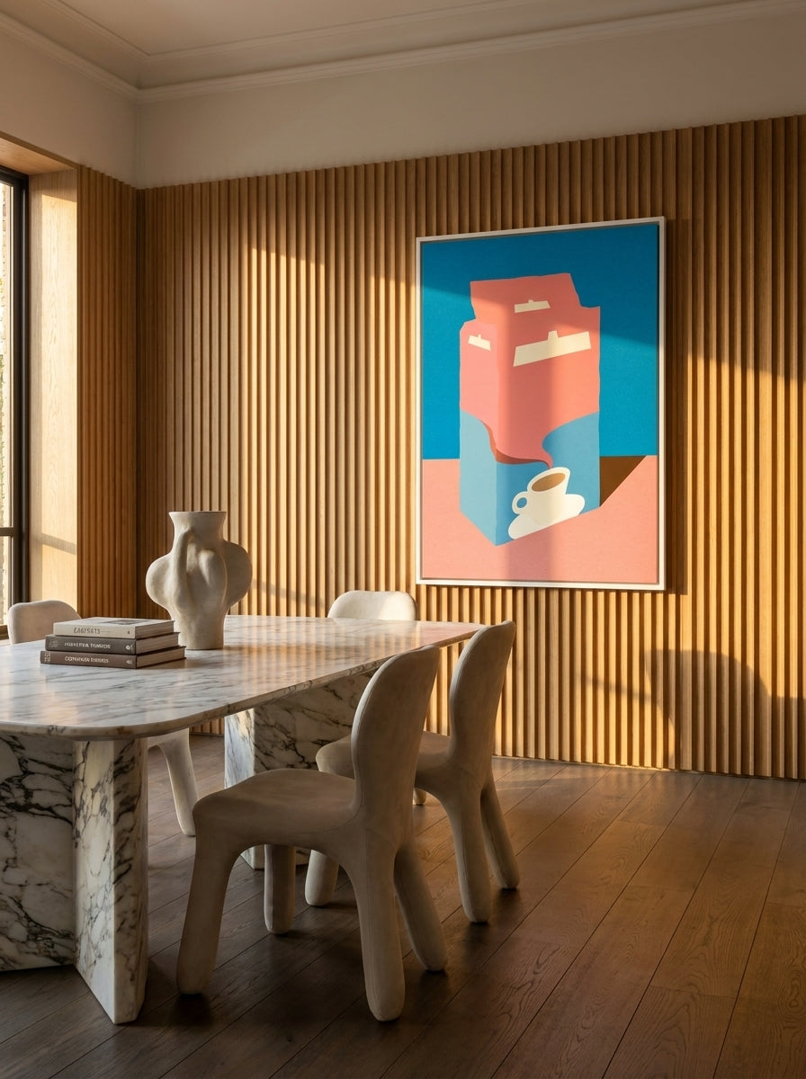 Oversized statement canvas wall art with a white surround styled on the wall in a luxe dining room