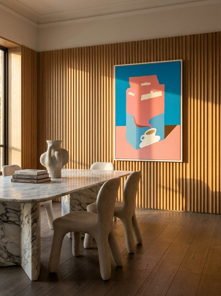 Oversized statement canvas wall art with a white surround styled on the wall in a luxe dining room