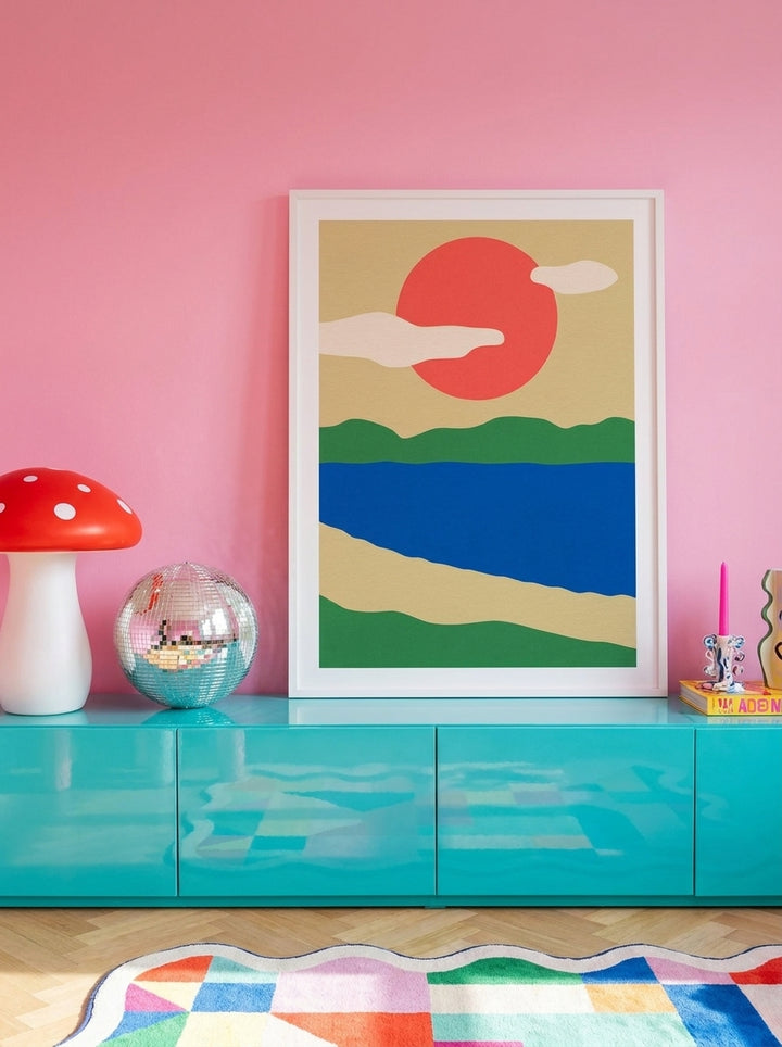 Modern wall art print standing on a sideboard in a colourful eclectic bedroom
