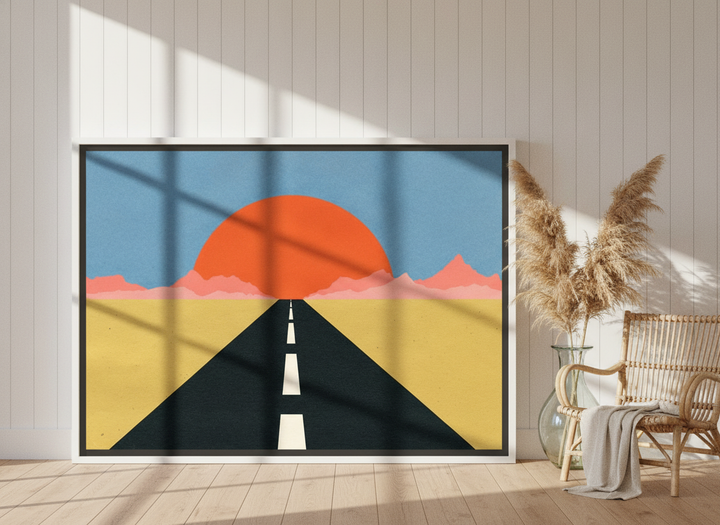 Oversized statement canvas wall art with a white surround leaning against the wall in a coastal dining room