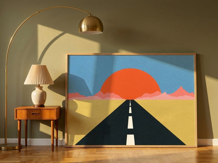 Modern wall art print leaning against the wall in a mid-century bedroom