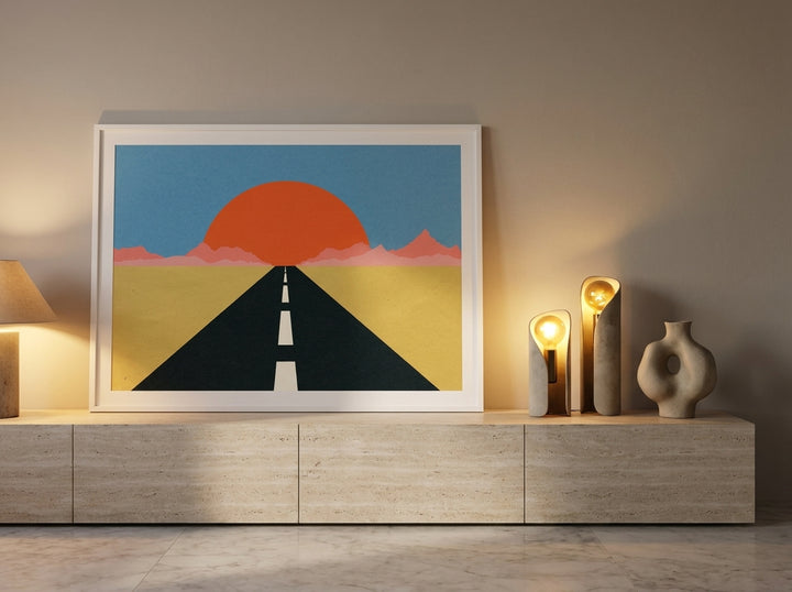Modern wall art print standing on a console in a luxe living room