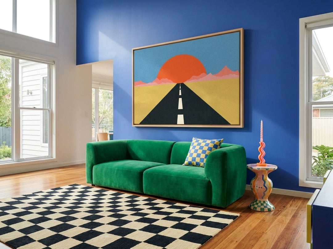 Oversized statement canvas wall art with a natural timber surround styled on the wall in a colourful eclectic living room