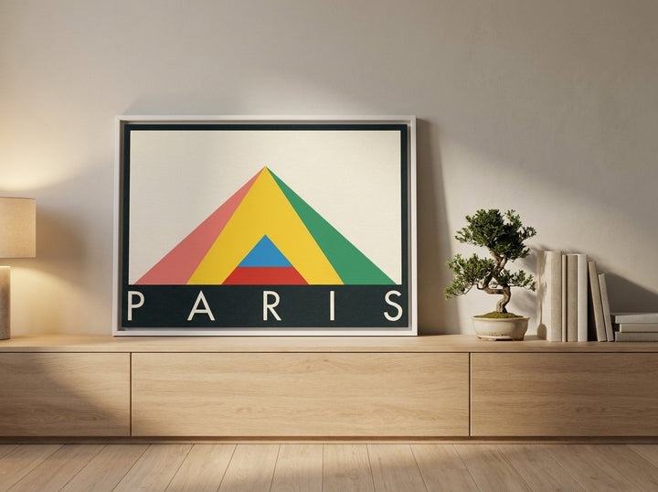 Canvas wall art with a white surround standing on a sideboard in a warm Japandi bedroom