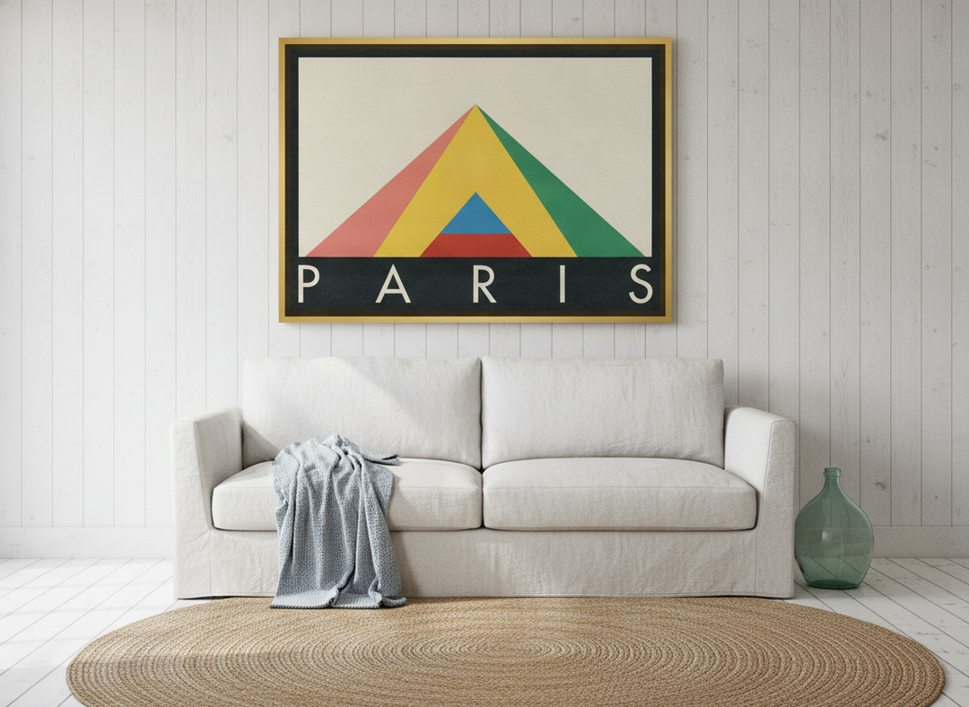 Oversized statement canvas wall art with a gold leaf surround styled on the wall in a coastal living room