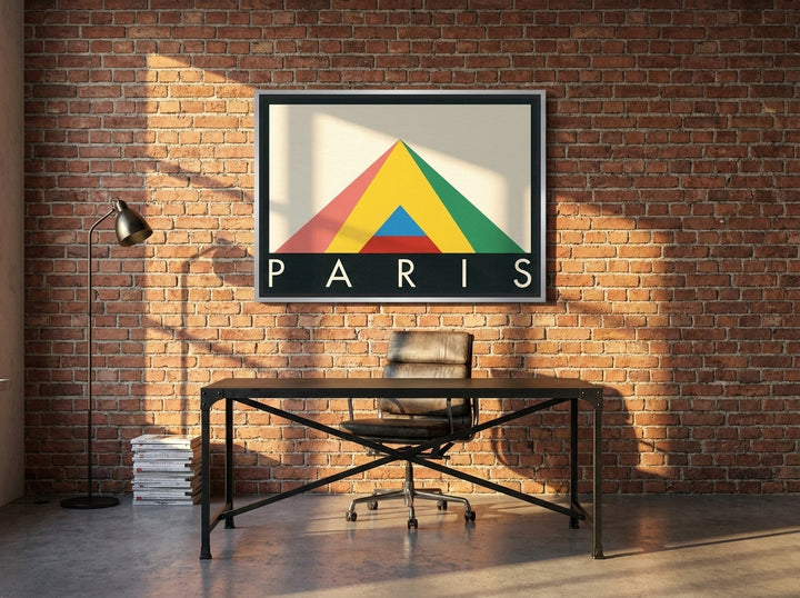 Canvas wall art with a silver leaf surround styled on the wall in an industrial loft home office
