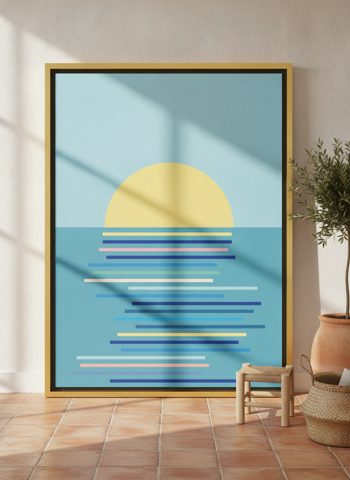 Oversized statement canvas wall art with a gold leaf surround leaning against the wall in a Mediterranean living room