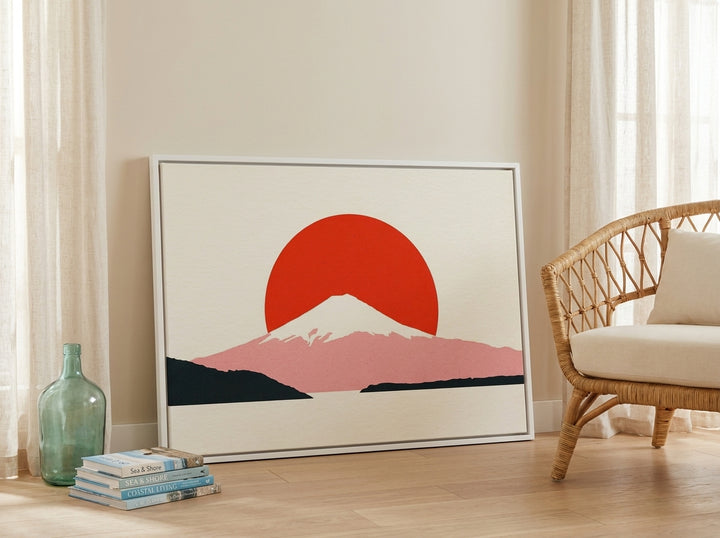 Canvas wall art with a white surround leaning against the wall in a coastal home office