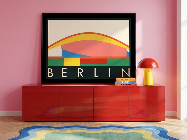 Modern wall art print standing on a sideboard in a colourful eclectic home office