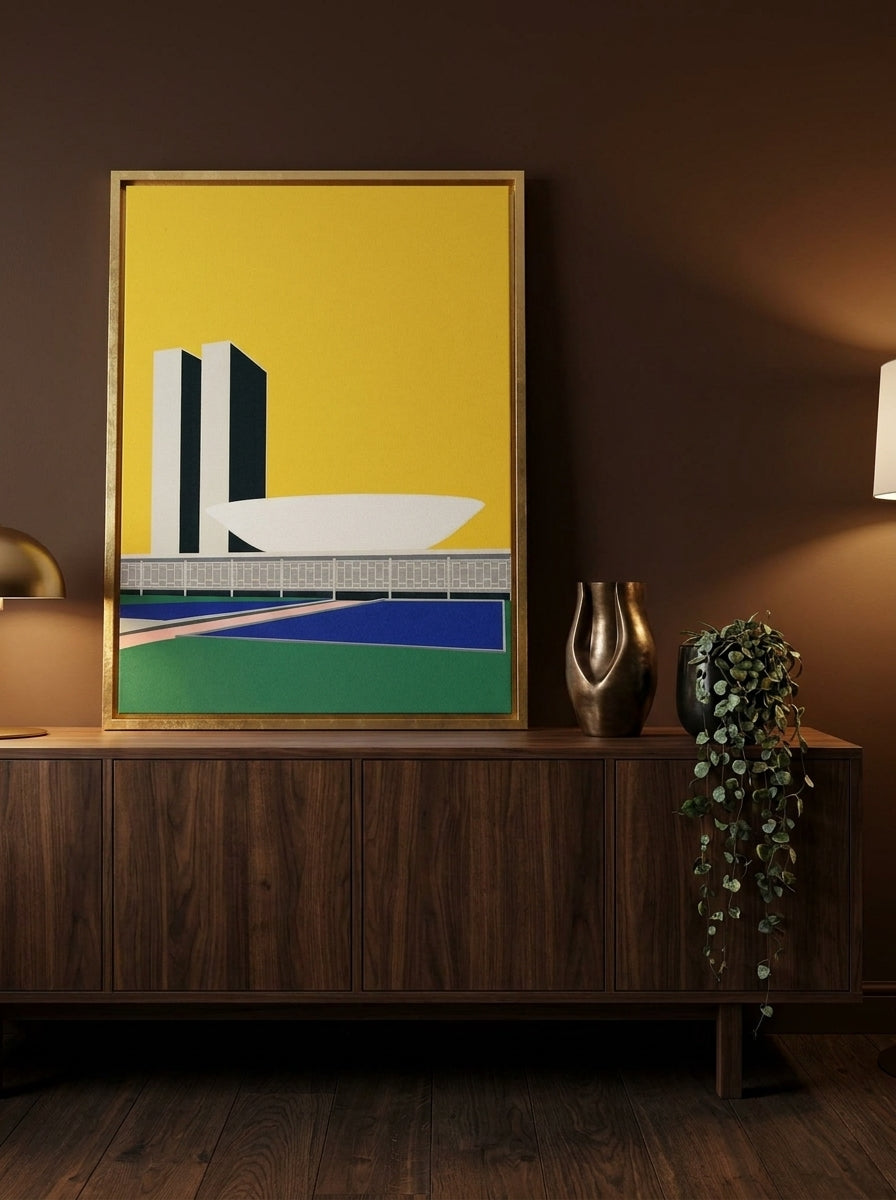 Canvas wall art with a gold leaf surround standing on a sideboard in a moody home office