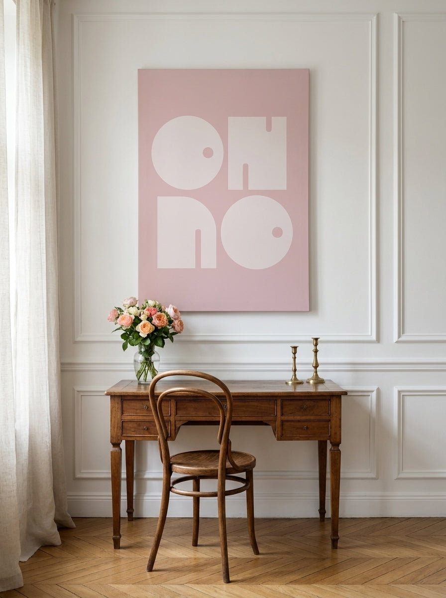 Stretched canvas wall art styled on the wall in a Parisian home office