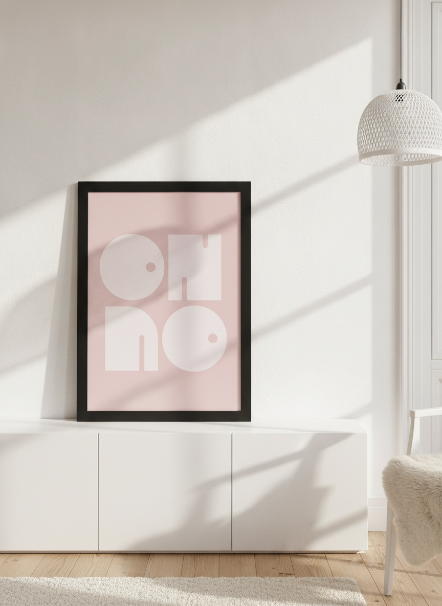 Modern wall art print standing on a sideboard in a bright Scandinavian home office