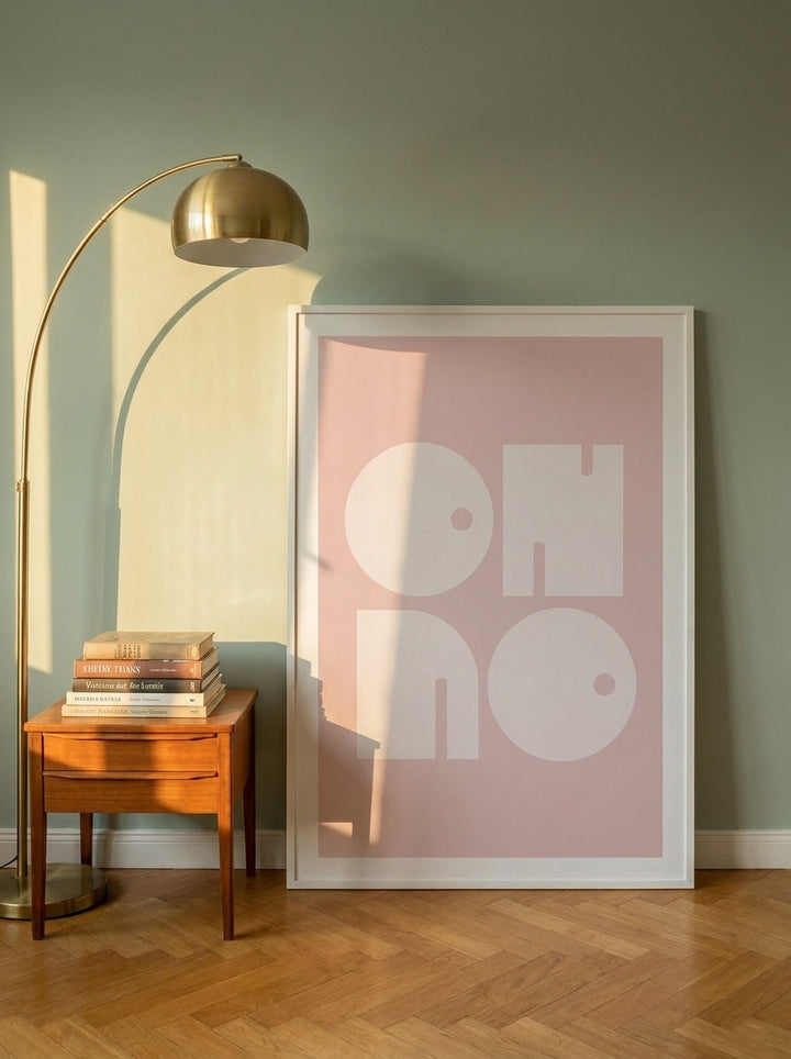 Oversized statement modern wall art print leaning against the wall in a mid-century living room