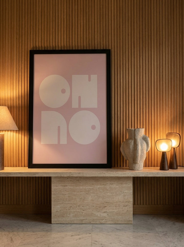 Modern wall art print standing on a console in a luxe dining room