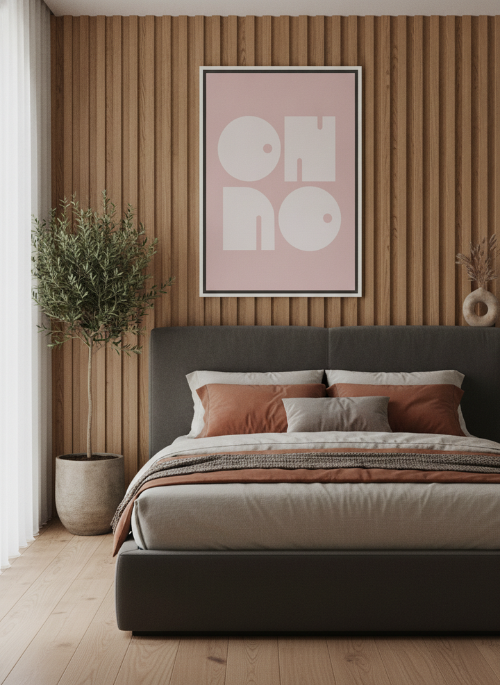 Canvas wall art with a white surround styled on the wall in a luxe bedroom