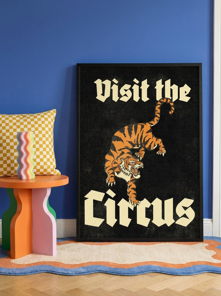 Oversized statement modern wall art print leaning against the wall in a colourful eclectic bedroom