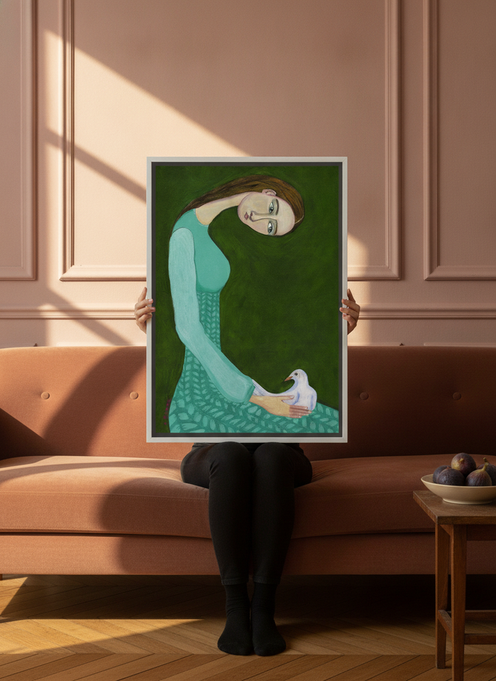 Person holding canvas wall art with a white surround in a Parisian living room