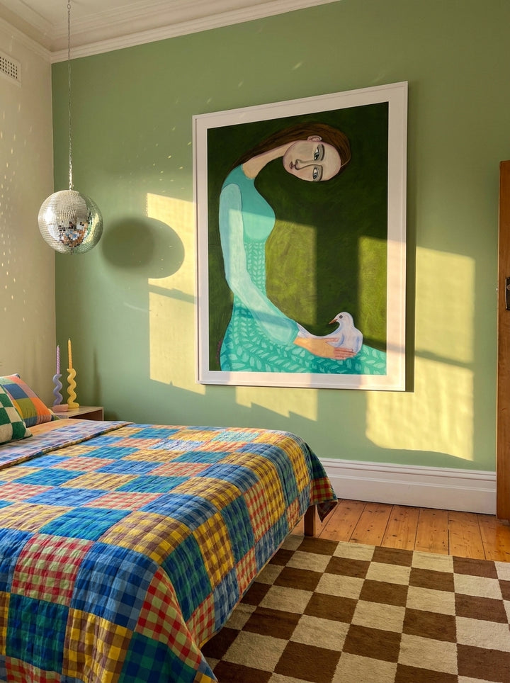 Oversized statement modern wall art print styled on the wall in a colourful eclectic bedroom