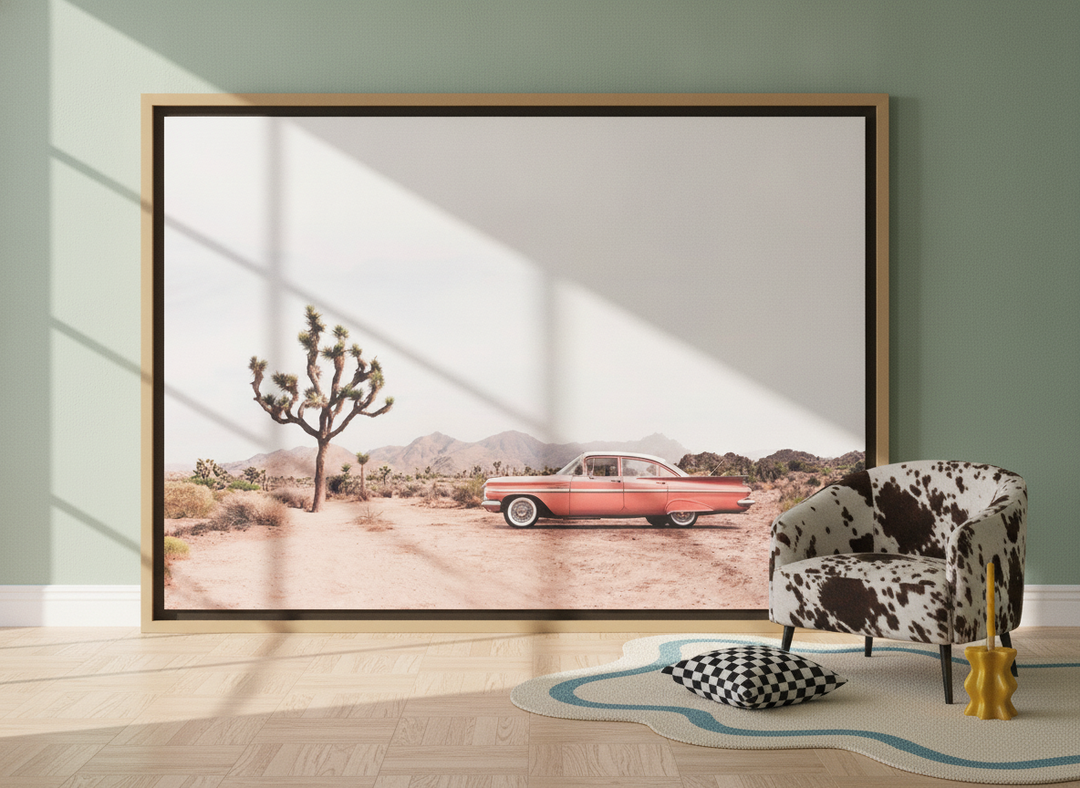 Oversized statement canvas wall art with a natural timber surround leaning against the wall in a colourful eclectic living room