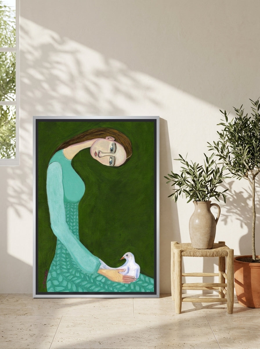 Canvas wall art with a silver leaf surround leaning against the wall in a Mediterranean bedroom