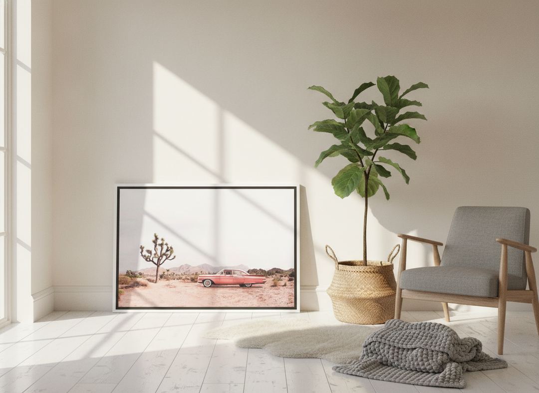 Canvas wall art with a white surround leaning against the wall in a bright Scandinavian home office