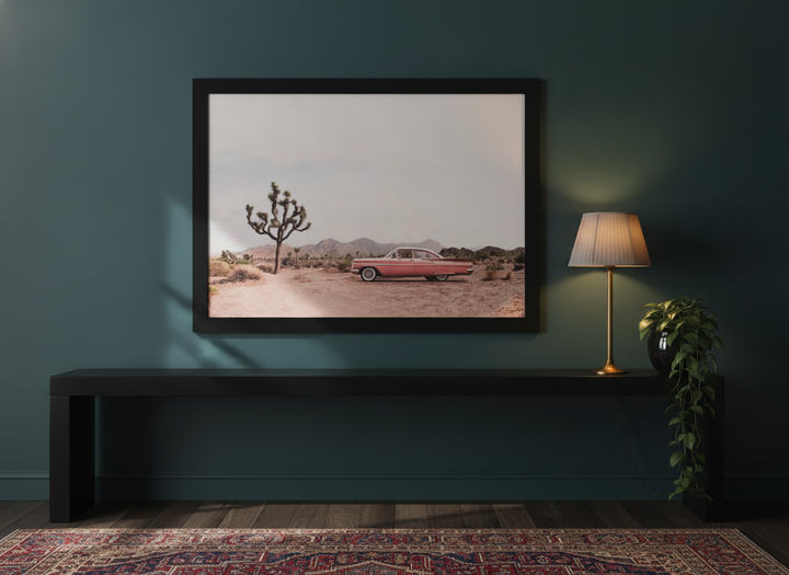 Modern wall art print standing on a console in a moody living room