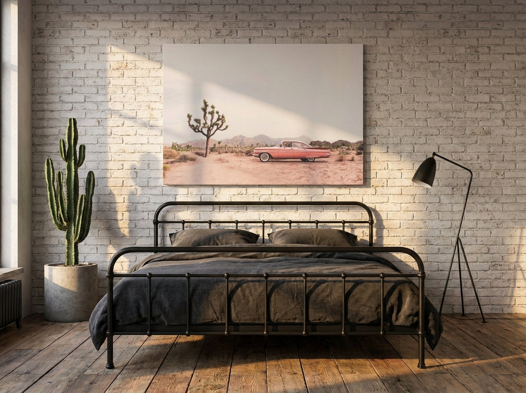 Stretched canvas wall art styled on the wall in an industrial loft bedroom