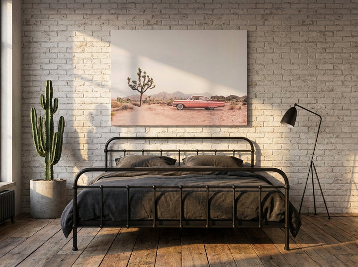 Stretched canvas wall art styled on the wall in an industrial loft bedroom