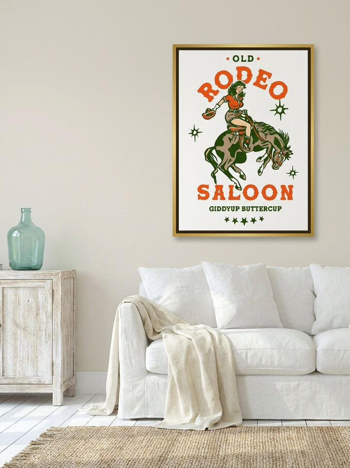 Canvas wall art with a gold leaf surround styled on the wall in a coastal living room
