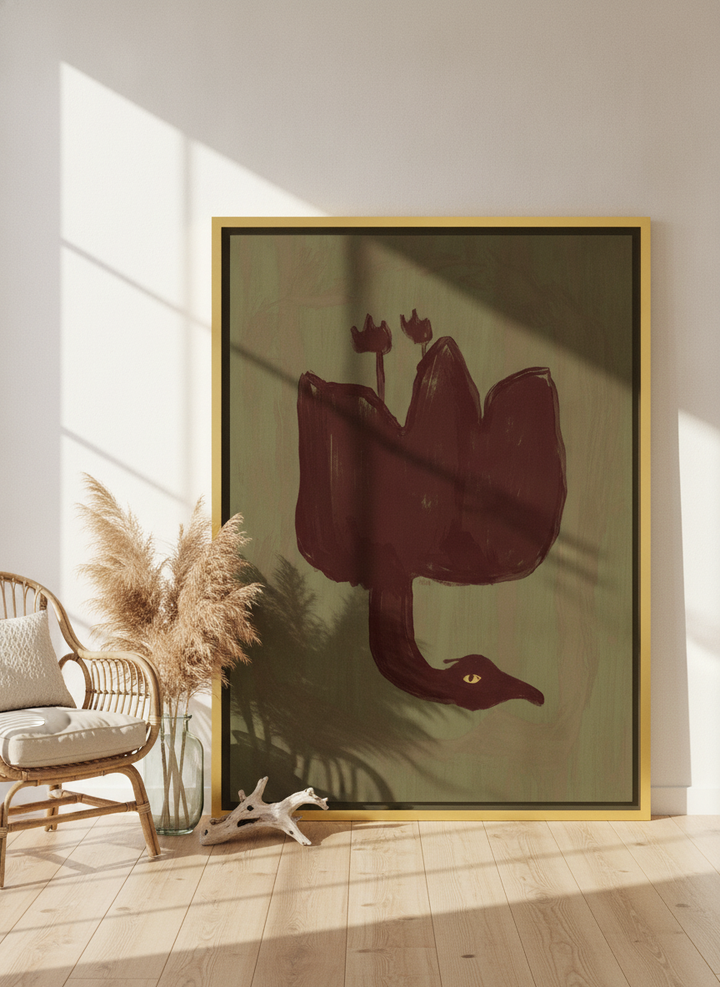 Oversized statement canvas wall art with a gold leaf surround leaning against the wall in a coastal living room