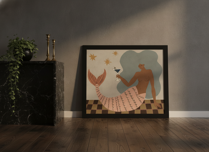 Modern wall art print standing on a kitchen bench in a moody kitchen
