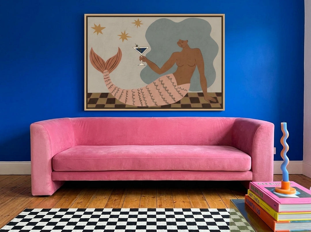 Oversized statement canvas wall art with a natural timber surround styled on the wall in a colourful eclectic living room