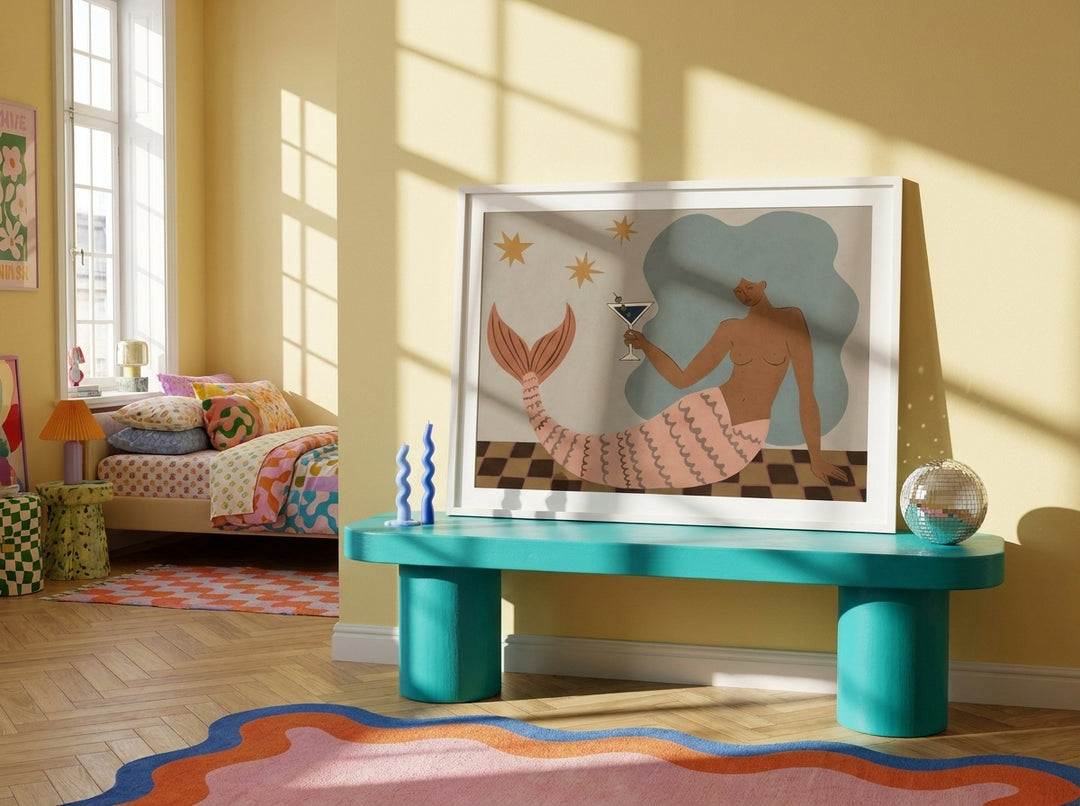 Modern wall art print standing on a side table in a colourful eclectic bedroom