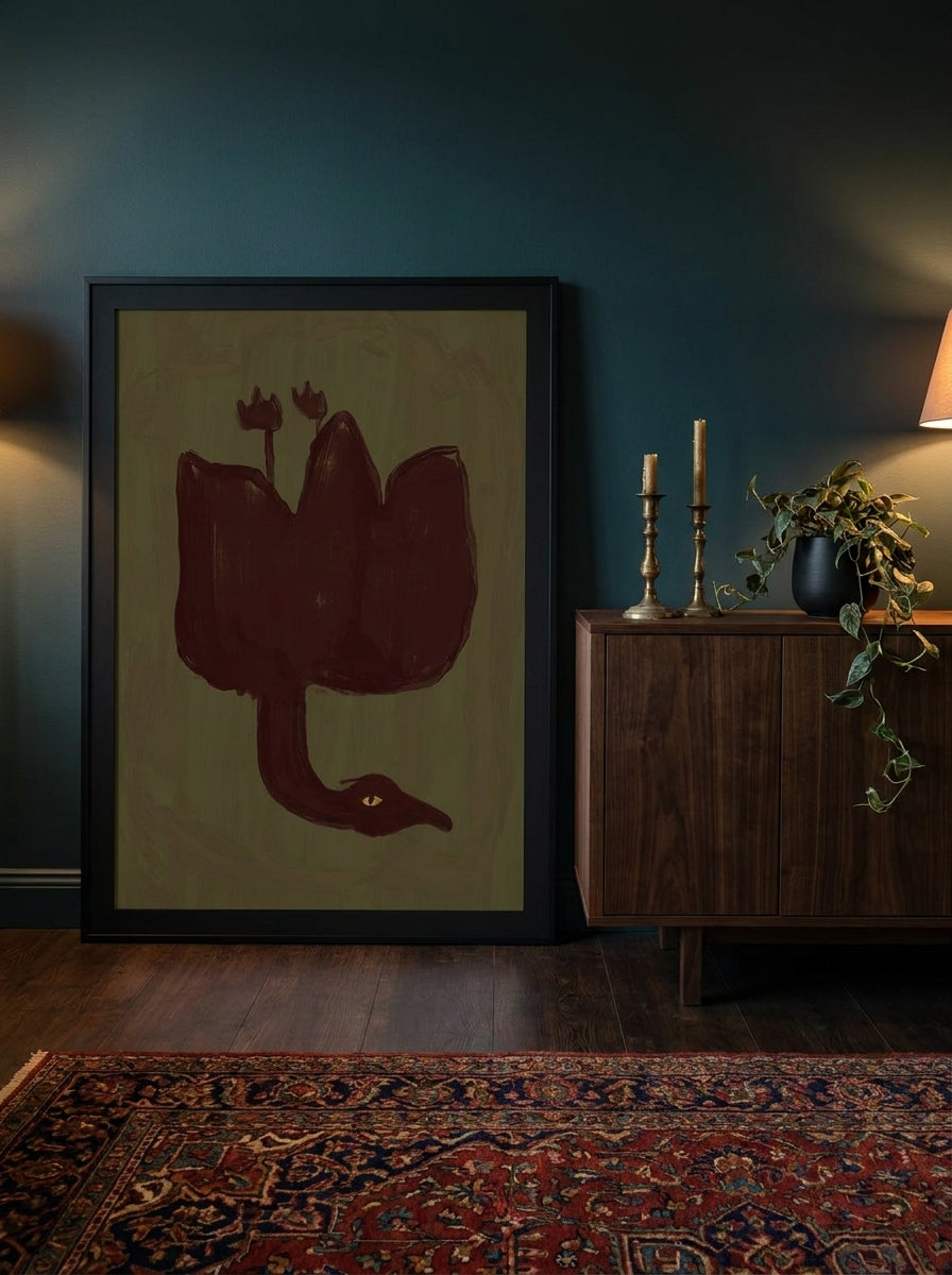 Modern wall art print standing on a sideboard in a moody home office