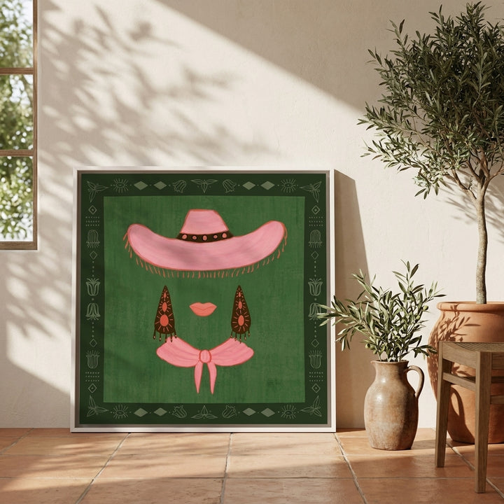 Canvas wall art with a white surround leaning against the wall in a Mediterranean home office