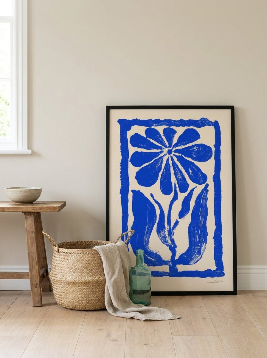 Modern wall art print leaning against the wall in a coastal kitchen