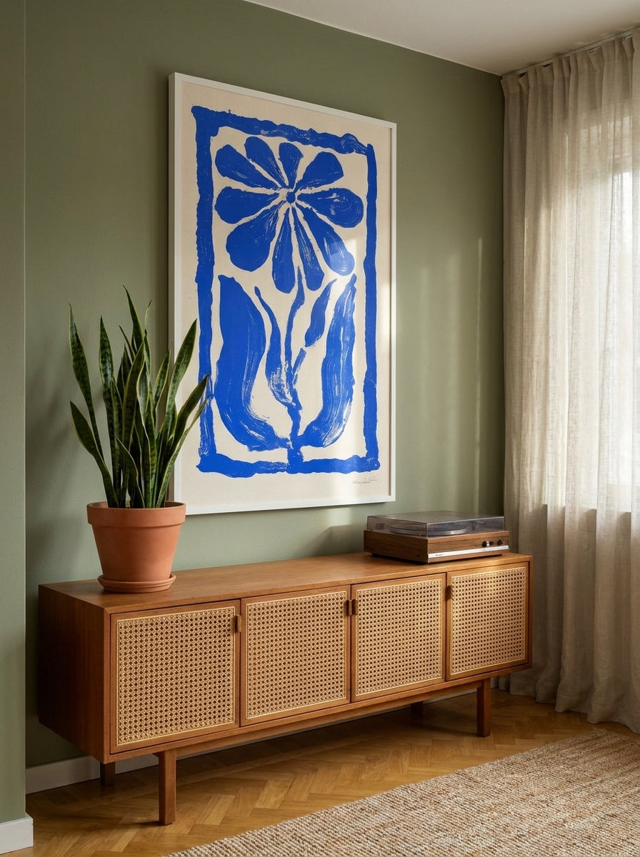 Oversized statement modern wall art print styled on the wall in a mid-century living room