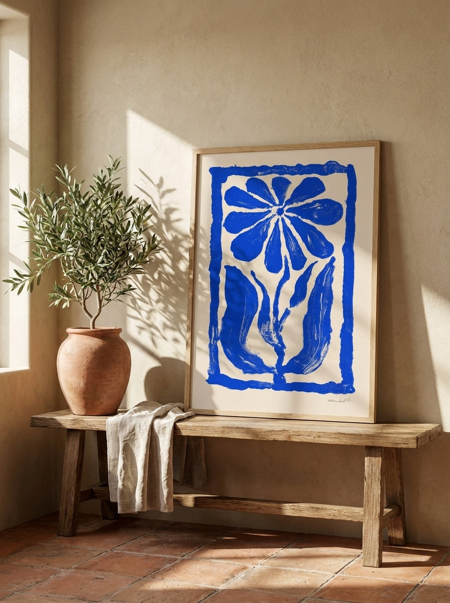 Modern wall art print standing on a bench in a Mediterranean home office