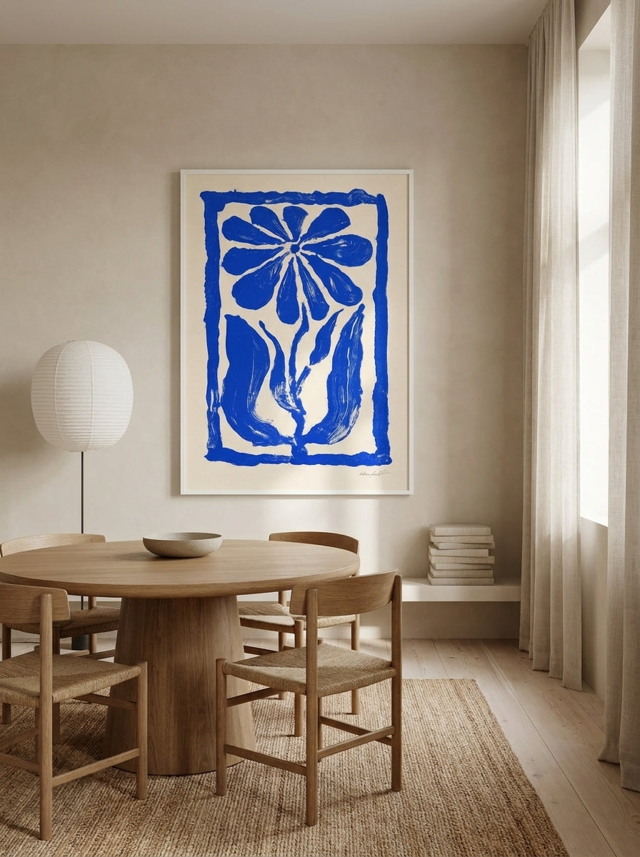 Oversized statement modern wall art print styled on the wall in a warm Japandi dining room