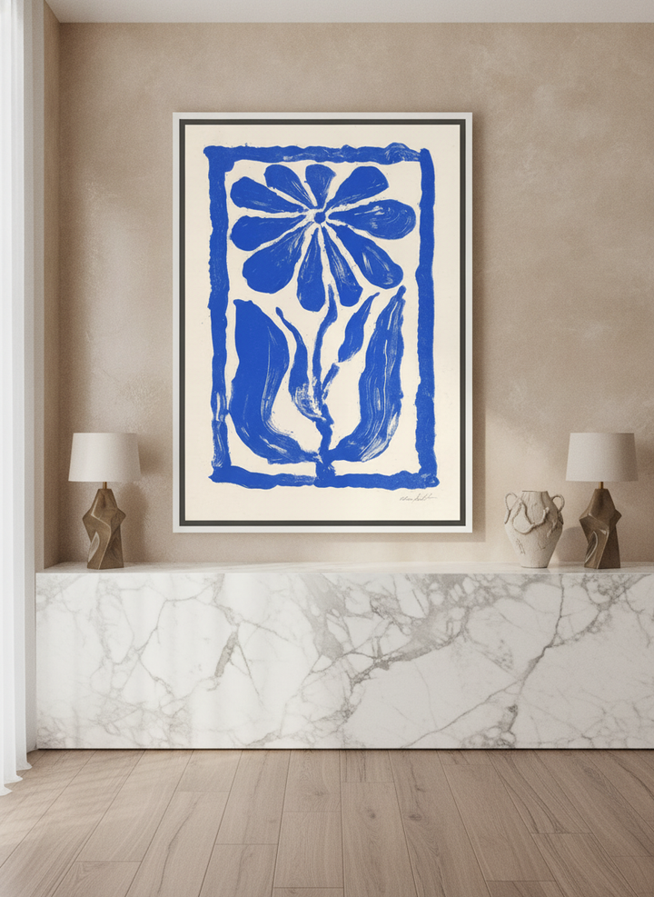Canvas wall art with a white surround standing on a kitchen bench in a luxe kitchen